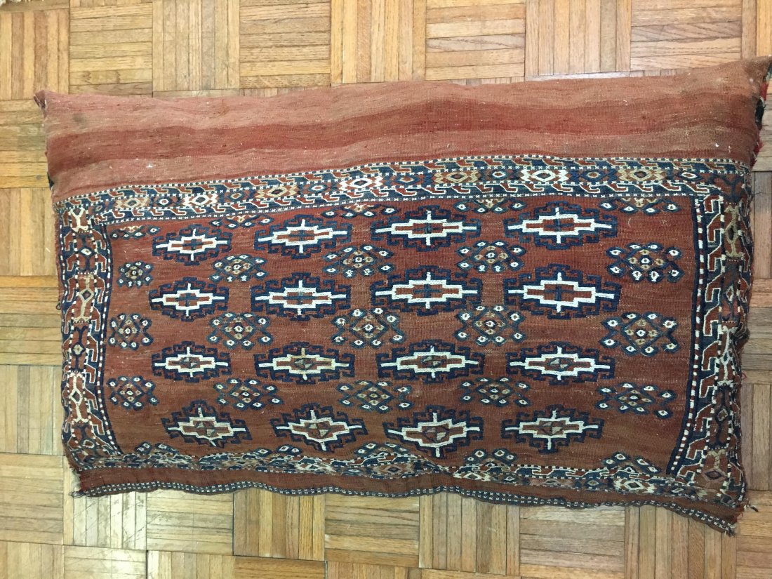 Antique Turkmen / Turkoman saddle bag covered Cushion: Antique Turkmen / Turkoman Sumac saddle bag Cushion measuring 25" inches wide by 44" inches long.