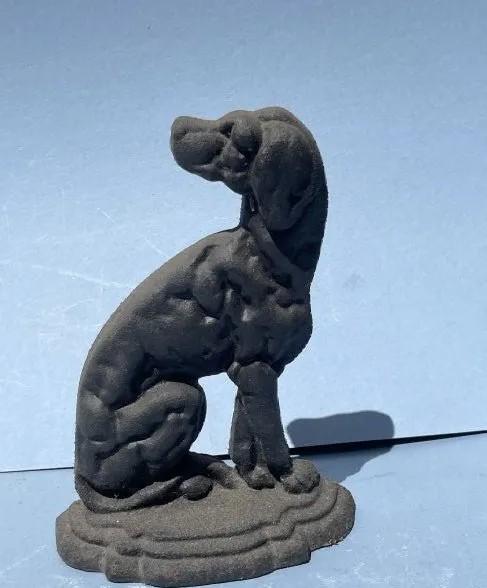 A Cast iron door stop Dog: A cast Iron DOG door stop.