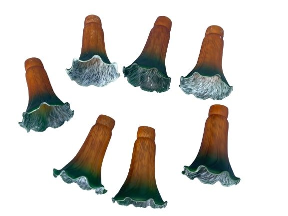 Tiffany style tulip lily glass Lamp Shades in green to amber: A group of seven Tiffany style tulip lily glass Lamp Shades in green to amber color.