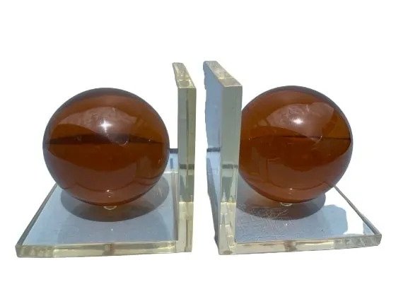 Pair of Plexiglas ball bookends: A Pair of Plexiglas ball bookends. Unique Plexiglas balls mounted into L shape bookends.