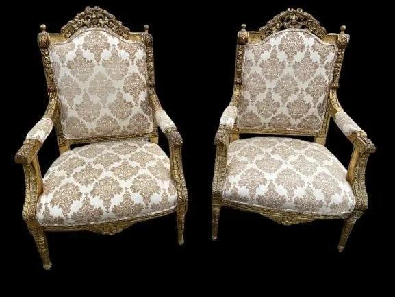 Pair of French Louis XVI FAUTEUIL armchairs: Pair of French Louis XVI FAUTEUIL armchairs.Gilt wood frame, carved crest with foliate, acanthus finials, velvet damask upholstered back, arms, and seat, carved floral medallions, rising on fluted tap