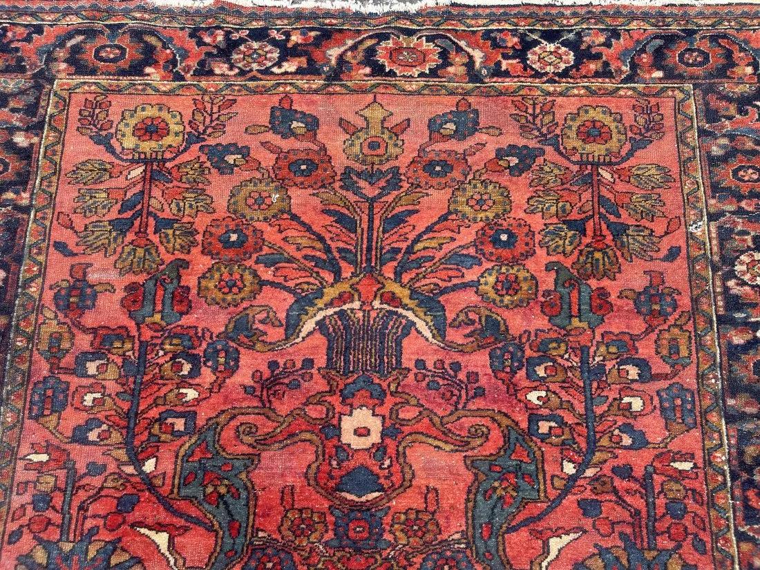 Antique Persian Lilihan Sarouk rug: Antique Persian Lilihan Sarouk rug measuring 5 feet 3 inches wide by 6 feet 6 inches long. A floral design rug on a Burgundy field and navy borders.