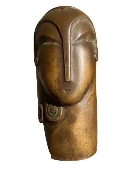 After Constantin Brancusi bronze statue: After Constantin Brancusi (Romanian 1876-1957) Bronze statue, Head of a woman. A patinated bronze with a foundry stamp, signed & dated C. Brancusi 1949. The work is placed on three level small pink ma