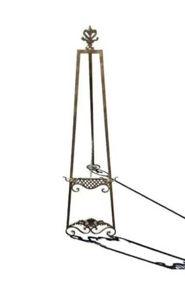Victorian style artist Brass Easel: Victorian style Artist metal Easel art stand measuring 19 inch wide bade by 67 inches tall.