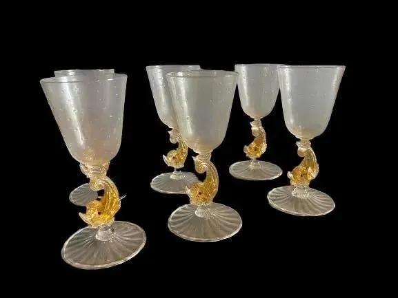 A set of 6 Salviati Venetian Dolphin Wine glass Goblets: A SET OF Six ITALIAN old Salviati Venetian wine Glass Dolphin Goblets.Handmade & blown very fine glass work. cup on a stylized scrolling tailed dolphin modeled stem and swirling circular foot.