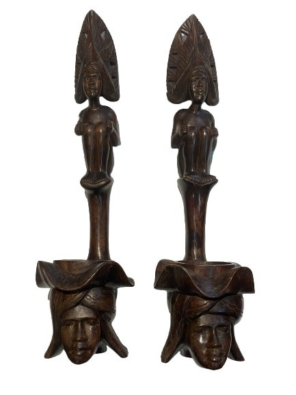 Pair of African Wood hand carved decorative statues: Pair of African Wood hand carved statues. Each measuring 24 inches tall and 7 inches wide. Unique decorative objects.