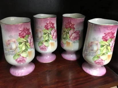 Set of four hand painted Nippon vases: A set of four hand painted Nippon vases measuring 5" inches 1/2 tall each.