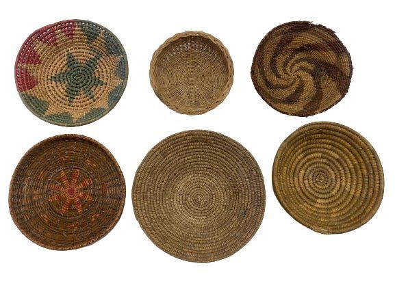 A group of six handwoven tribal baskets: A group of six handwoven tribal decorative baskets. Each with different pattern and size.