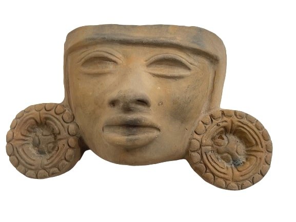 A Terracotta Clay Aztec Mexican Mayan decorative face.: A Terracotta Clay Aztec Mexican Mayan decorative face measuring 8 inches wide by 5 inches tall.