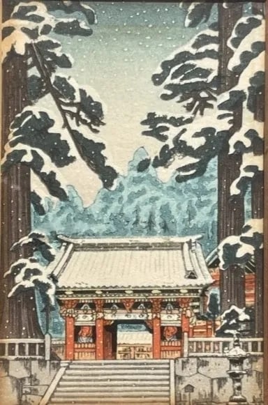 A Japanese Woodblock print of a temple in snow: A Japanese Woodblock print of a temple in snow. Sight measures 3 1/4 inches wide by 5 inches long. Glass covered frame measures 9 by 10 1/4 inches long.