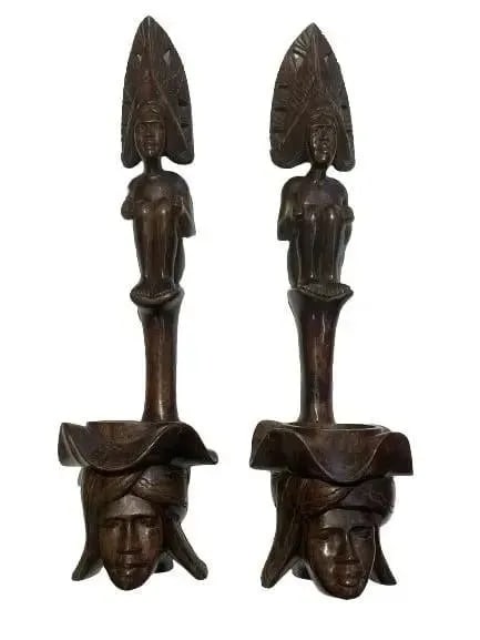 Pair of African Wood hand carved decorative statues: Pair of African Wood hand carved statues. Each measuring 24 inches tall and 7 inches wide. Unique decorative objects.