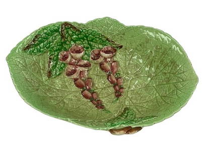 An English Carlton Ware majolica leaf bowl: An English Carlton Ware majolica leaf bowl measuring 8 1/4 inches long by 5 3/4 inches wide. Stamped by Carlton Ware, made in England, designed in Australia.