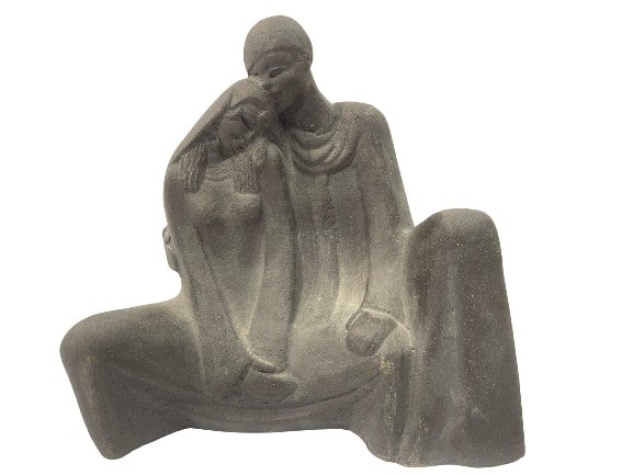 A Moroccan sculpture of a couple in love: A Moroccan sculpture of a couple in love. A signed pottery sculpture of a couple embracing. Measuring 10 inches tall by 10 inches long. A unique & decorative art work.