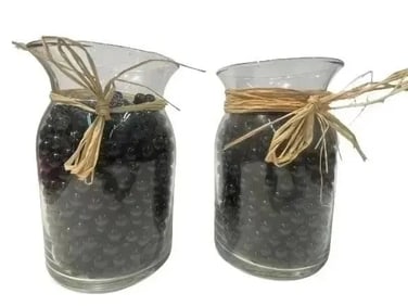 Two jars full of glass marbles