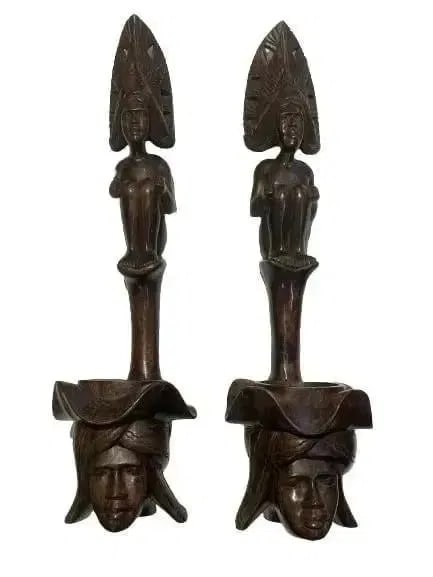 Pair of African Wood hand carved decorative statues: Pair of African Wood hand carved statues. Each measuring 24 inches tall and 7 inches wide. Unique decorative objects.