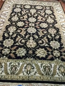 A handwoven Indian Mahal wool rug