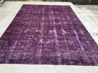 An overdyed persian tabriz rug