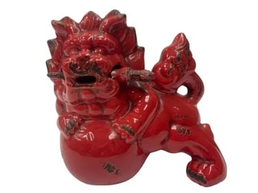 A Chinese Foo Dog glazed pottery statue