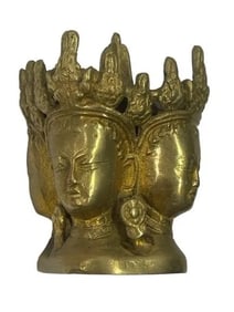 A brass Tibetan incense burner with a quad Buddha deity figures