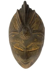 A hand carved Java Batik wooden mask