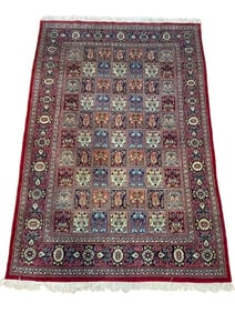 A Persian Qum wool panel design rug