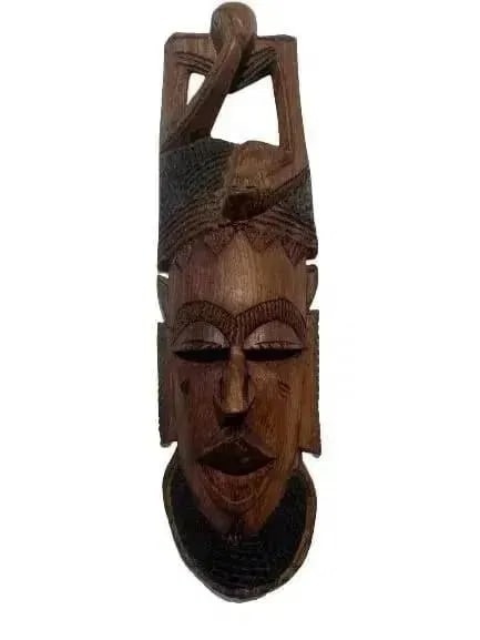 African decorative hand carved Mask: African decorative hand carved wooden Mask measuring 18 inches tall by 6 inches wide.