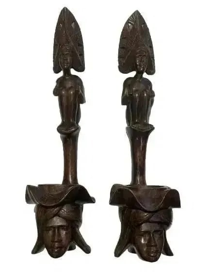Pair of African Wood hand carved decorative statues: Pair of African Wood hand carved statues. Each measuring 24 inches tall and 7 inches wide. Unique decorative objects.