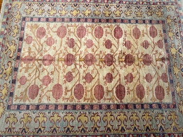 A Pakistan Handwoven Khotan Pomegranate design wool Rug