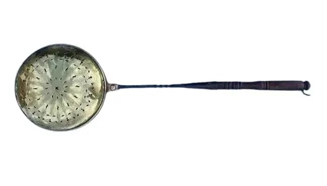 Brass Bed Warmer: A Brass Bed Warmer with a wood handle with a detailed pierced & hammered design. Cast iron and copper wrapping on the wood handle