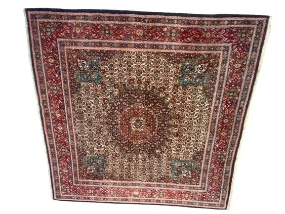 A Square Persian Moud hand woven wool rug: A Square Persian Moud hand woven wool rug measuring 6 feet 7 inches wide by 6 feet 7 inches long. A finely woven wool hand knotted genuine Persian Moud rug with an ornate center medallion.