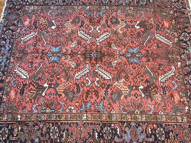 Antique Persian Heriz handwoven wool rug