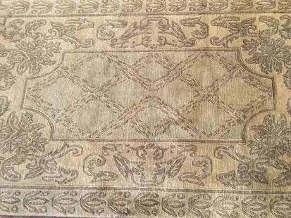 A contemporary Nepalese hand woven wool rug: A contemporary Nepalese hand woven wool rug measuring 4 feet wide by 5 feet 10 inches long
