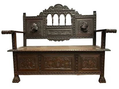 Antique Gothic German Carved oak Bench: Antique Gothic German Carved oak Bench with trunk storage. The entire bench measures 55 inches wide, 19 inches depth, 46 inches back seat height and the seat height is 19 inches. A finely carved