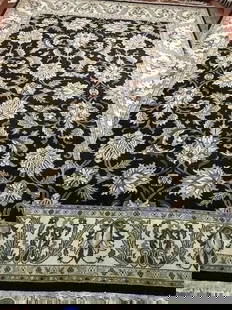 A handwoven Indian Mahal wool rug: A hand woven Indian Agra Mahal wool rug. Measuring 9 ft wide by 12 ft long.