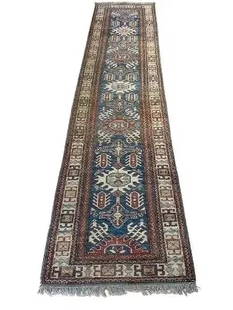 A Pakistan Kazak handwoven Runner: A Pakistan Kazak handwoven Runner measuring 2 feet 7 inches wide by 10 feet 8 inches long. A used handwoven tribal Caucasian Kazak design runner rug. hand knotted wool on wool rug.