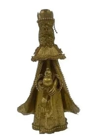 A Tin candle holder figure