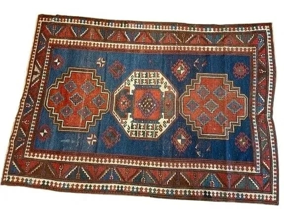 Antique Caucasian Lori Pambak Kazak rug: Antique Caucasian Lori Pambak Kazak rug measuring 5 feet 4 inches wide by 7 feet 5 inches long. A triple geometric medallion on a blue field surrounded with triangular wine glass and leaf border syste