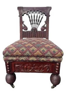 Antique Gothic Victorian chair: Antique Gothic Victorian chair with brass wheels.Measurements 33 inches tall, long by 20 inches wide and 16 inches seat height. A beautiful decorative antique Victorian Gothic hand carved chair.