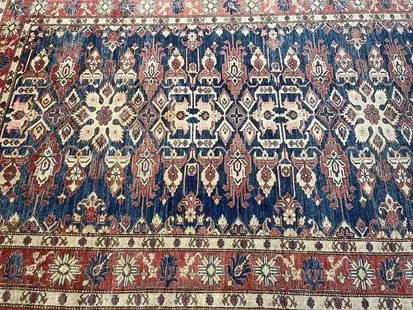 A Pakistan Kazak handwoven rug: A Pakistan Kazak hand woven rug measuring 5 feet 11 inches wide by 8 feet 8 inches long. A finely woven tribal Caucasian Kazak design made with pure wool.