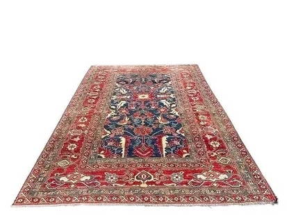 A Pakistan Kazak hand woven wool rug: A Pakistan Kazak hand woven wool rug measuring 7 feet 2 inches wide by 10 feet long. A finely woven tribal design hand knotted wool rug.