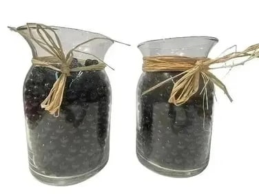 Two jars full of glass marbles
