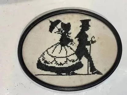 Antique American Needlepoint Embroidery of a man & woman: Antique American Needlepoint Embroidery of a man & woman on a stroll .Oval shape framed measuring 8 inches by 10 inches wide.