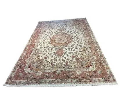A genuine Persian Tabriz wool & silk room size rug 8.2 by 11.8: A genuine Persian Tabriz wool & silk room size rug measuring 8 feet 2 inches wide by 11 feet 8 inches long. A finely woven wool Tabriz rug with wool pile with silk highlights + cotton fringes. A cente