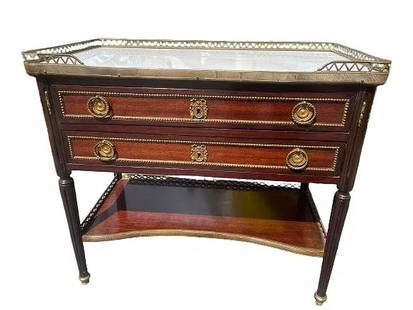 A Louis XVI style Bronze mounted Mahogany marble top table: A Louis XVI style Bronze mounted Mahogany night stand marble top table. A marble top table with bronze railing on two levels with two pull drawers.A french EN Chiffonnire night stand table.Measuring 1