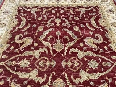 A handwoven room size oriental rug