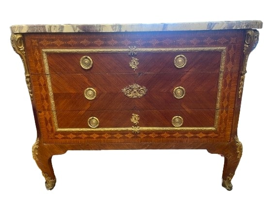 Antique French LOUIS XVI STYLE COMMODE: A French LOUIS XVI STYLE COMMODE 19th century with bronze ormolu and a marble top. measuring inches , inches inches, Three freeze drawers and a gorgeous natural marble top.