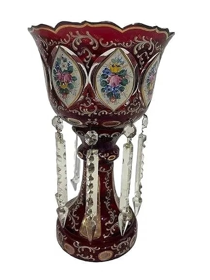 A Bohemian Ruby Red Glass Mantle Luster with clear prism: A Bohemian Ruby Red Glass Mantle Luster standing 13 inches tall. A beautiful hand painted Bohemian luster with hand cut clear prism.