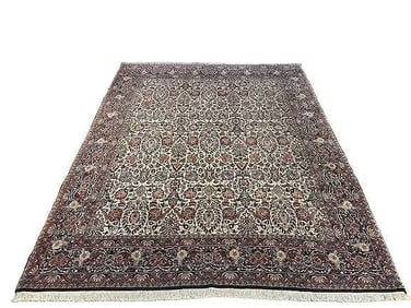 A Persian Bijar hand woven wool rug