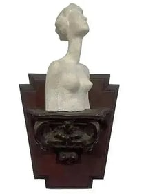 A unique Female Clay Bust on a sconce
