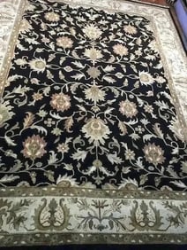 A handwoven Indian Kashan wool Rug